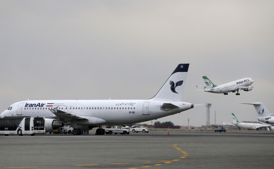 An Iran Air jet sits on the tarmac of Tehran's Mehrabad airport. Last month, Boeing announced it had signed a provisional agreement for the sale or lease of more than 100 aircraft to the national carrier over the next decade.