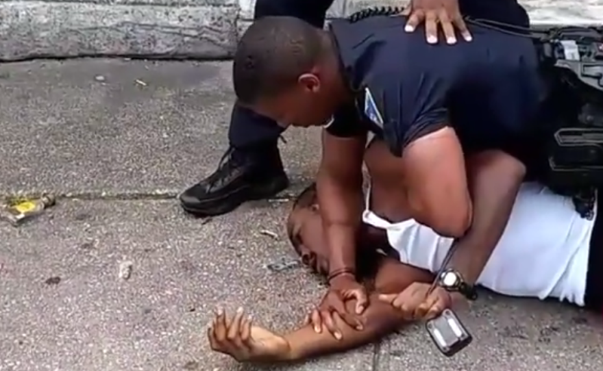 A short video posted on social media showed a police officer repeatedly punching a man on the street.