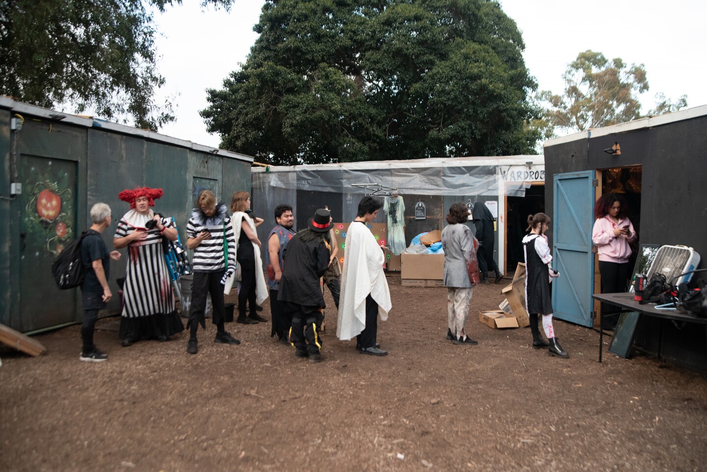 Scare actors, also referred to as "scaracters" by Haunted Trail's Greg De Fatta, line up for make up and costumes. Sept. 25, 2025.