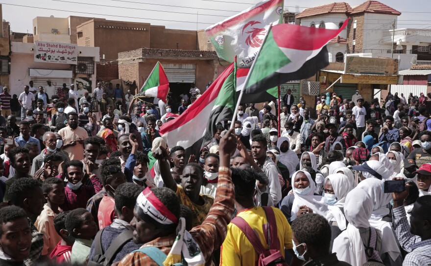 People in Khartoum, Sudan, on Sunday seen protesting to denounce the October 2021 military coup. Sudanese security forces fired tear gas to disperse protesters as thousands rallied against military rule, medics said.