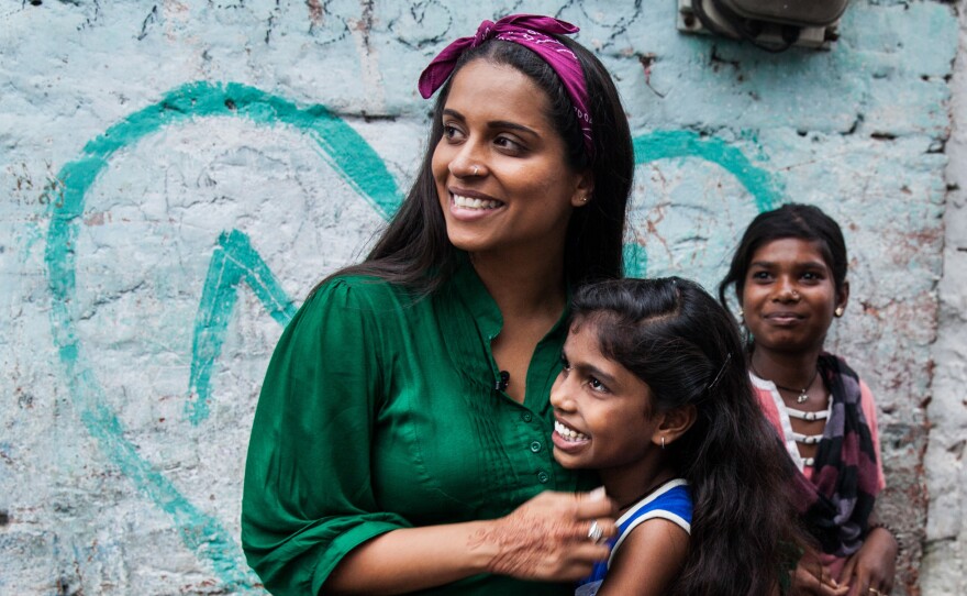 UNICEF Global Goodwill Ambassador and YouTube personality Lilly Singh meets children supported by the U.N. agency in Nagar, India, in July.