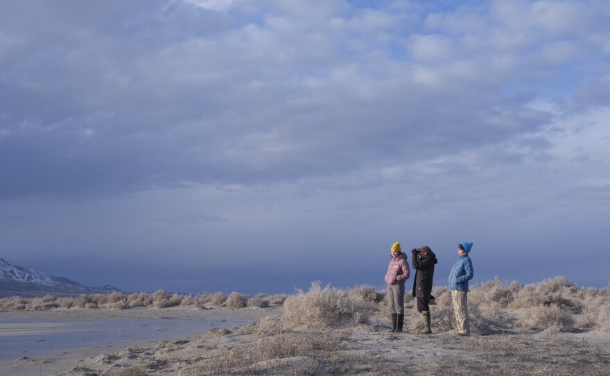 Scientists Carly Biedul, Bonnie Baxter and Heidi Hoven look for migratory birds on the eerily dry south shore of the Great Salt Lake in Utah.