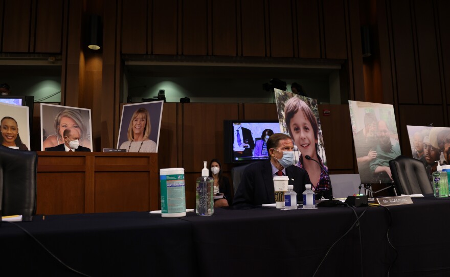 Democrats on the Senate Judiciary Committee display photos of people who have been impacted by the Affordable Care Act, as the lawmakers argue that confirming Amy Coney Barrett to the Supreme Court would be detrimental to health care.
