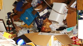 Piles of "stuff" are heaped throughout this hoarder's house.