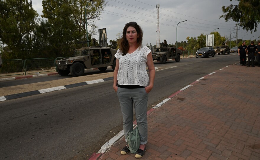 Ronit Sela, a longtime advocate of Palestinian rights, volunteers as a driver. "As a human rights activist, I can say that I chose humanity. And right now there are families with kids, and disabled people, who are just in panic and they need to be evacuated to a safe place," she says.