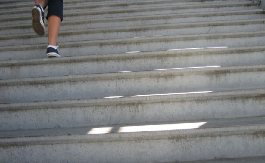 A student runs up stairs at Monroe Clark Middle School in City Heights.