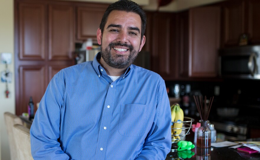 Edgar Guerrero, a military contractor and Navy veteran in the eastern Chula Vista neighborhood of San Miguel Ranch, poses for a photograph in his home, April 14, 2017.