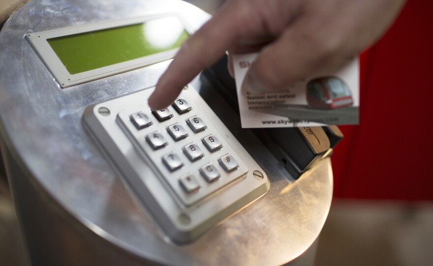 To use SkyWeb Express, the passenger would swipe a fare card and enter the destination station code on the boarding station before entering the car.