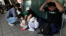 People take cover inside at a MRT station during the Urban Resilience (Air-Defense) Exercise, part of the annual Han Kuang military exercises in Taipei, Taiwan, Thursday, Aug. 13, 2026.