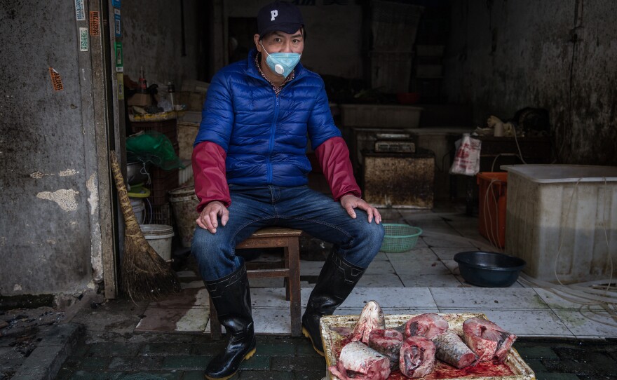 A street vendor operates in an alley.