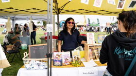 Author Tracy Badua is seen at a booth at the Filipino American Friendship Festival in this undated photo.