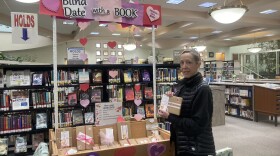 Rancho Penasquitos Library Branch Manager Adrianne Peterson standing near a Valentines Day display.