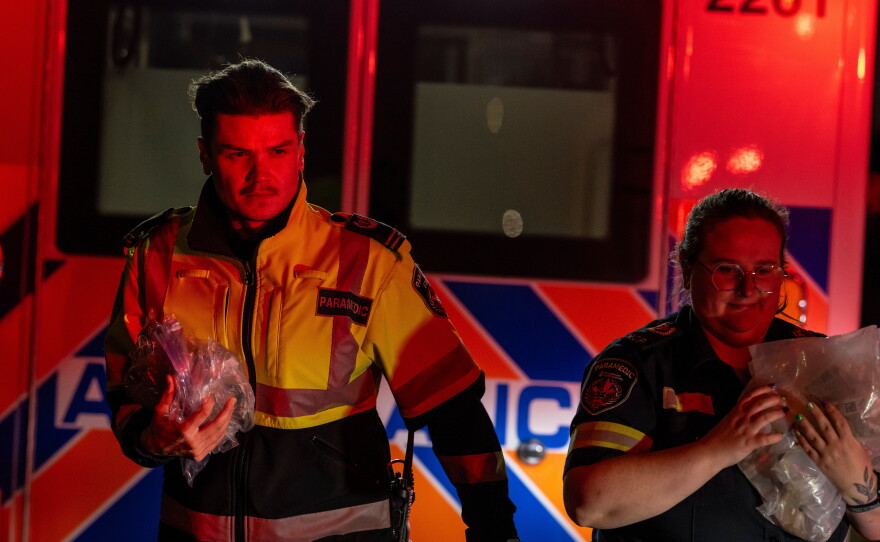 Paramedics work at the Wainwright Health Centre as injured military members are treated after a fire at Canadian Forces Base Wainwright, outside of Wainwright, Alberta Saturday, Oct. 17, 2026.