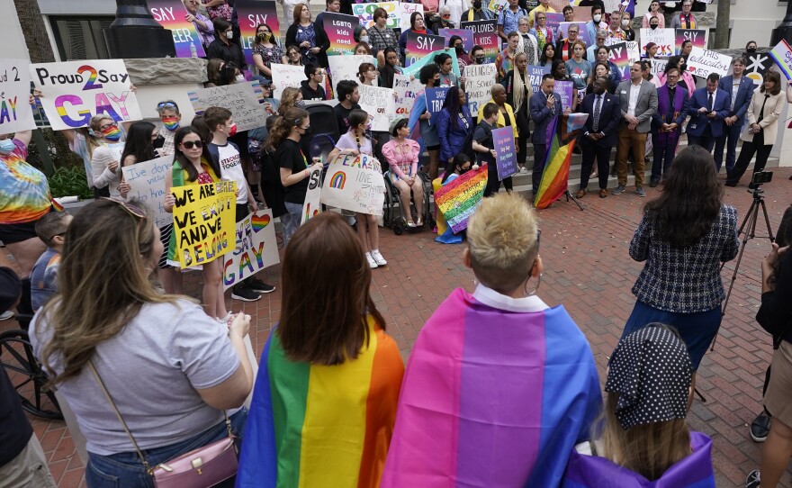 Demonstrators gather on the steps of the Florida Historic Capitol Museum in front of the Florida State Capitol, March 7, 2022, in Tallahassee, Florida