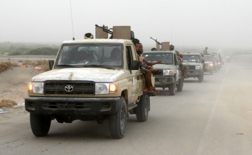 A column of Yemeni pro-government forces, travels Wednesday about five miles south of Hodeidah international airport. Backed by the Saudi-led coalition, the fighters launched an offensive to retake the rebel-held Red Sea port city.