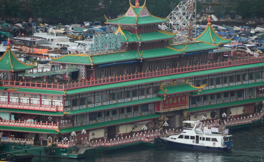 Hong Kong's iconic Jumbo Floating Restaurant is towed away in Hong Kong on June 14. It capsized at sea less than a week later.