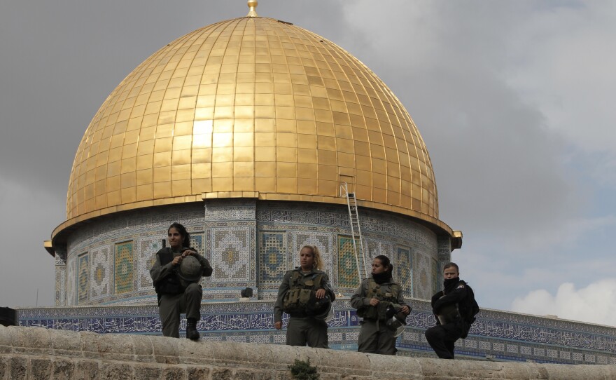 Israeli security forces stand guard near Jerusalem's Dome of the Rock mosque in the Haram al-Sharif compound, one of the holiest sites in Islam. It's also the most sacred place in Judaism. Israeli police clashed with stone-throwing Palestinians inside a nearby mosque on the compound as Jewish nationalists visited the site.