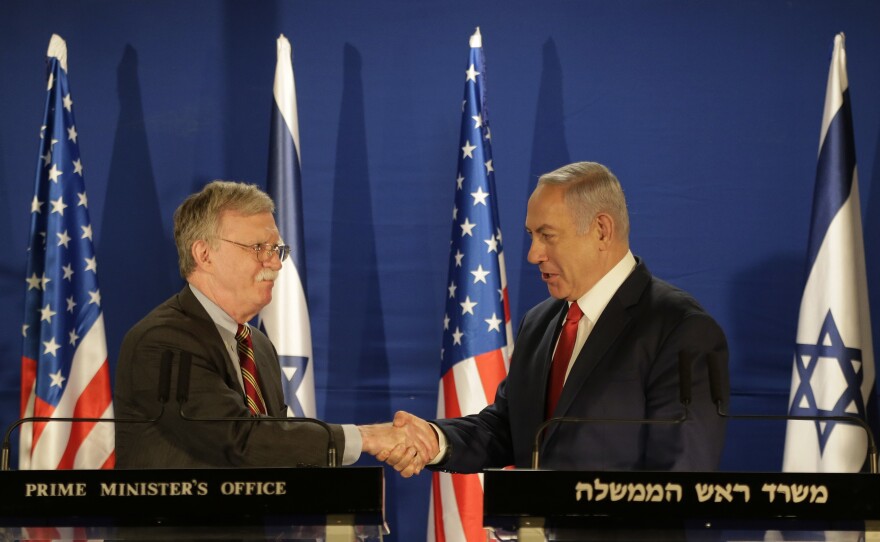 U.S. National Security Advisor John Bolton (left) and Israeli Prime Minister Benjamin Netanyahu shake hands during a joint statement to the media follow their meeting, in Jerusalem on Sunday.