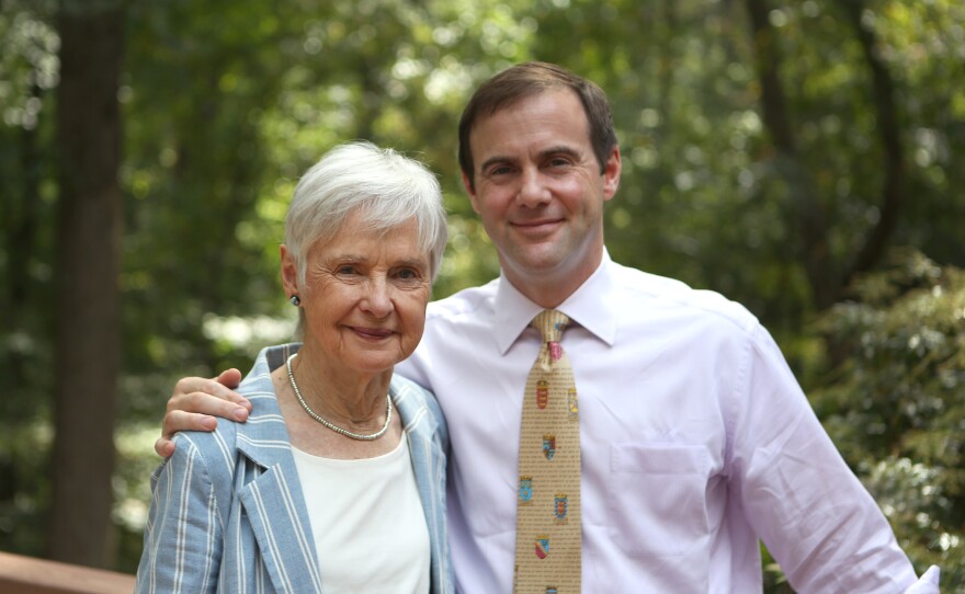 Maureen Scalia and her son Christopher stand on the back porch of the family's home in Virginia.