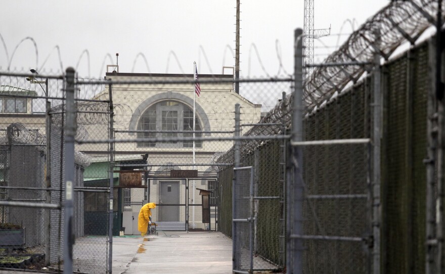 A man does maintenance work at the Monroe Correctional Complex in Monroe, Wash., in a 2016 photo. At least six inmates in a minimum-security unit of the prison have tested positive for the coronavirus.