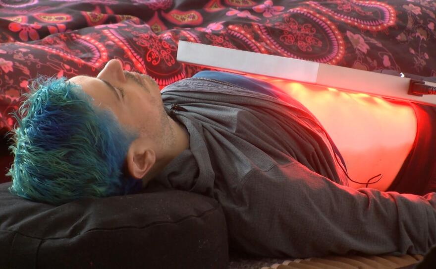 Joel Sprechman uses infrared therapy to ease symptoms of Inflammatory Bowel Disease at his home in Del Mar on January 30, 2018.