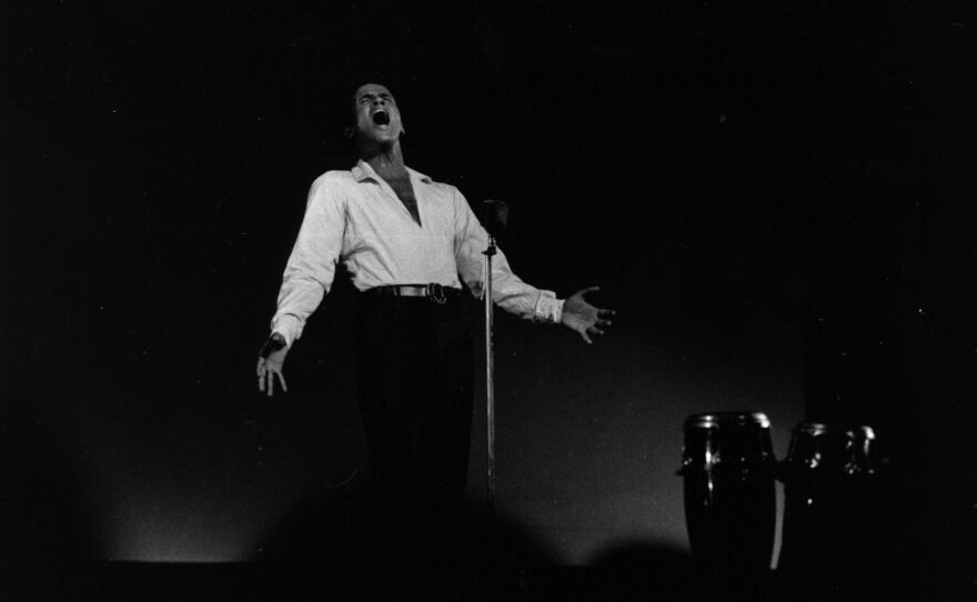 Calypso singer and actor Harry Belafonte performs in concert at London's Kilburn National Ballroom on Aug. 10 1958.