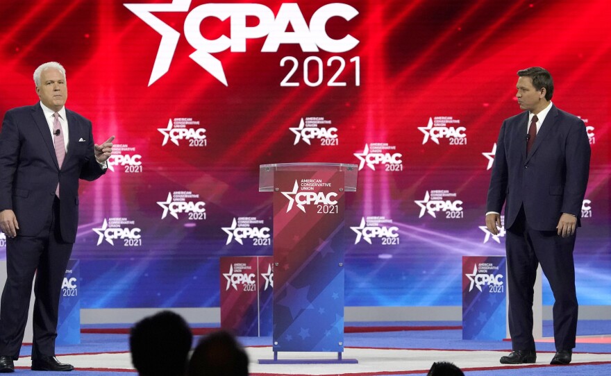 Matt Schlapp, left, introduces Florida Gov. Ron DeSantis at the 2021 Conservative Political Action Conference in Orlando, Fla.