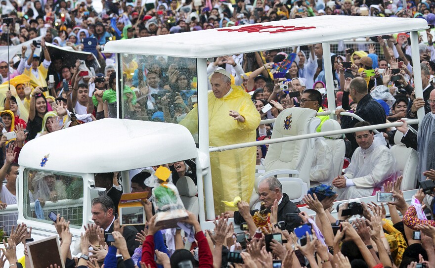 Pope Francis waves to the crowd as he arrives at Quirino Grandstand to celebrate his final Papal Mass in Manila, Philippines, on Sunday. In his homily, Francis warned about the Philippine government's "insidious" family planning program.