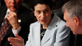 Senate Finance Committee member Olympia Snowe (R-ME) confers with fellow committee member Jon Kyl (R-AZ) as Orrin Hatch (R-UT) looks on during the committee's Tuesday hearing regarding health care.