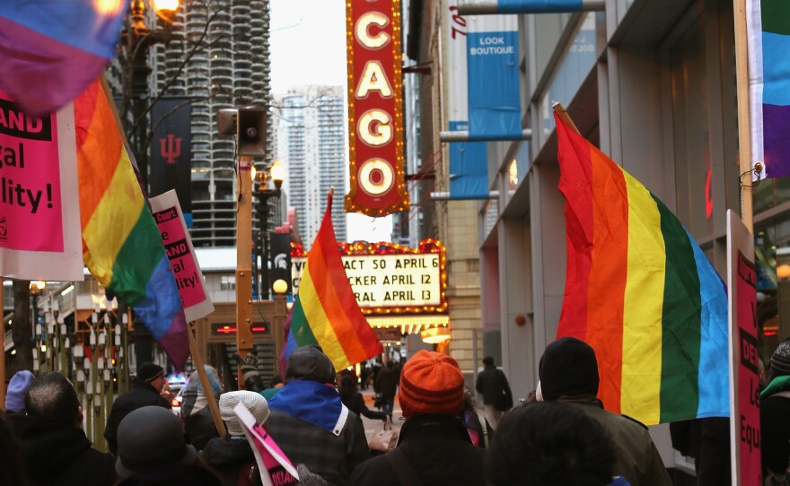 Activists rally in support of gay marriage on March 25 in Chicago. The Illinois Senate has approved legislation that will legalize same-sex marriage, but it has stalled in the state House.