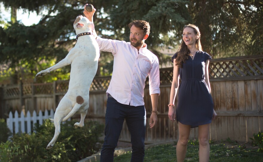 Katherine Harmon Courage with her husband, David, and their dog, Raz.