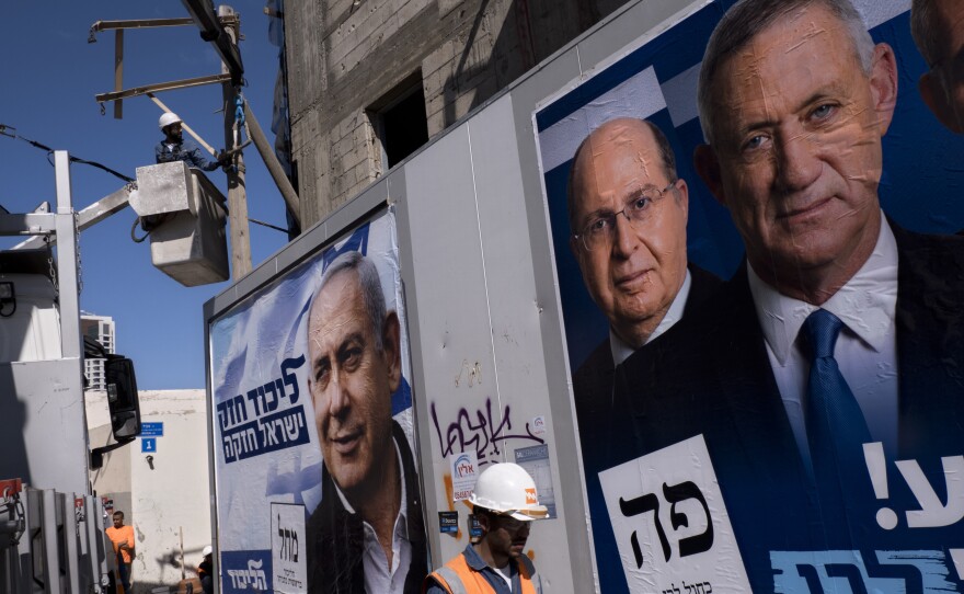 Election campaign billboards in Tel Aviv showing Israeli Prime Minister and head of the Likud party Benjamin Netanyahu (left), alongside the Blue and White alliance leaders Moshe Yaalon and Benny Gantz.
