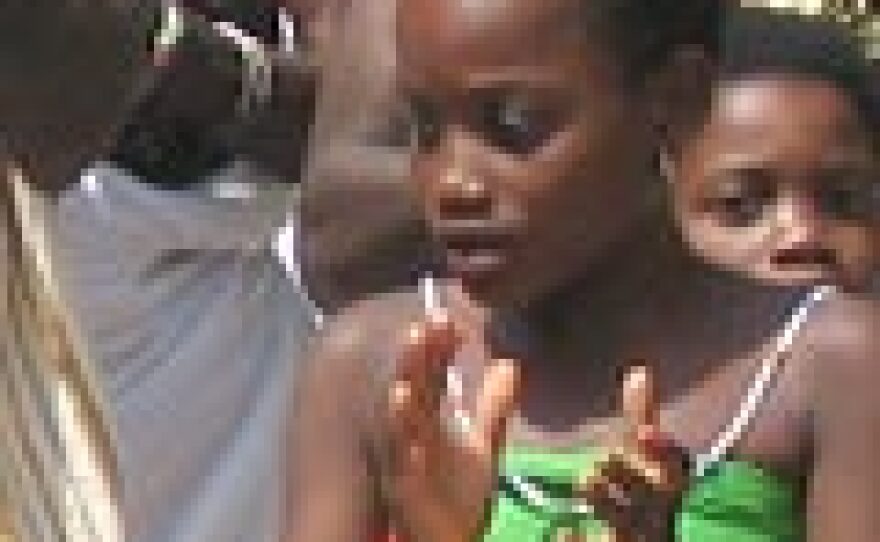 Girl dances at Epe Ekpe festival, Glidji, Togo.