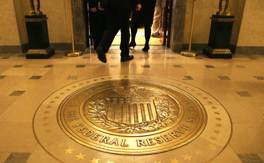 Citing continued signs of weakness, the Federal Reserve said it will keep aiming for low interest rates.