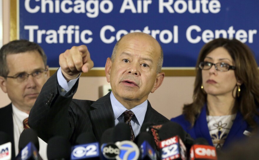 Federal Aviation Administration Administrator Michael Huerta answers questions Friday after touring the Chicago air traffic control center with Sen. Mark Kirk, R-Ill. (left), and city aviation Commissioner Rosemarie Andolino.