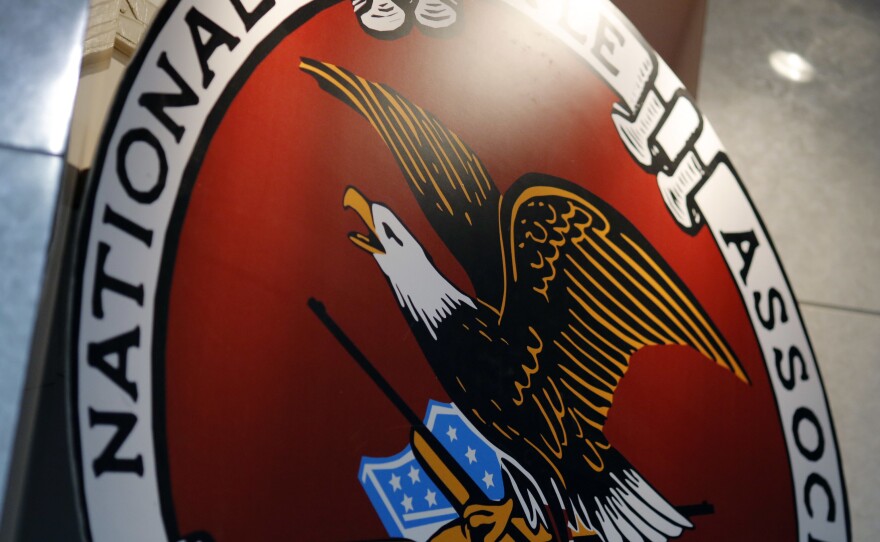 The logo of the National Rifle Association is seen at an outdoor sports trade show in 2017.