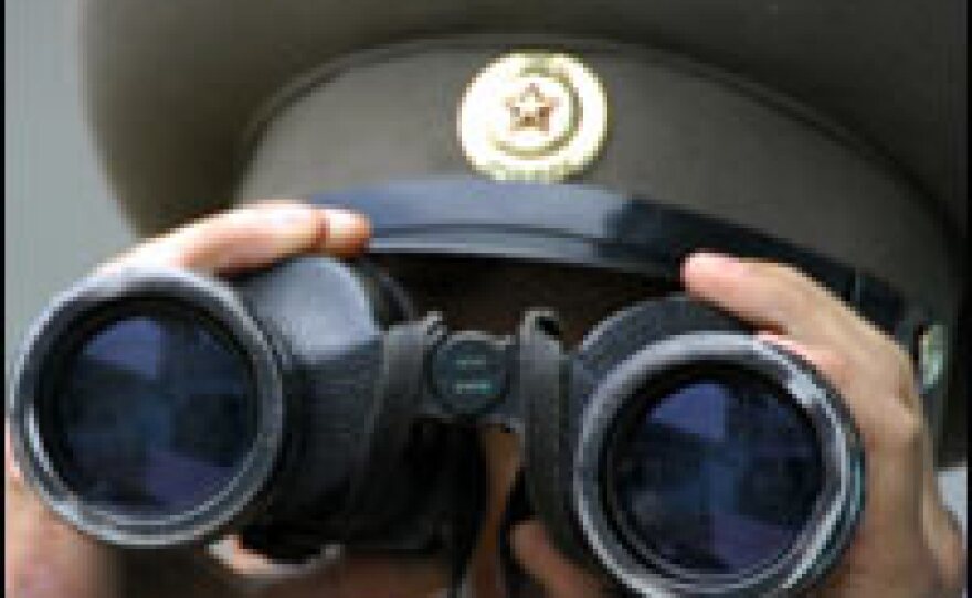 A North Korean soldier looks at the South side at the border village of Panmunjom in the Demilitarized Zone (DMZ) dividing North and South on Thursday.