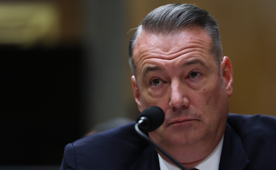 FILE - Todd Lyons, senior official performing the duties of the director at U.S. Immigration and Customs Enforcement, listens during a Senate Homeland Committee hearing on Capitol Hill in Washington, Feb. 12, 2026.