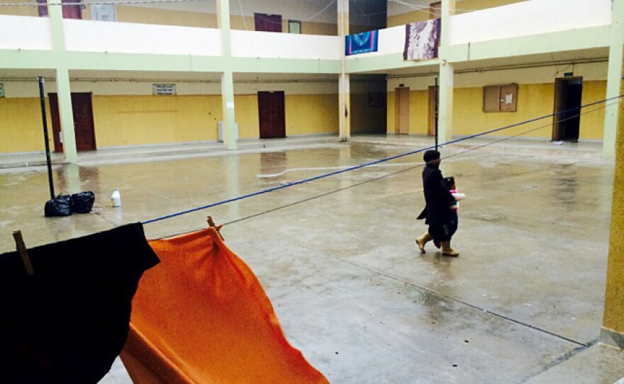 An elementary school in Bayda where displaced families are staying. Children play in the freezing courtyard of the school.