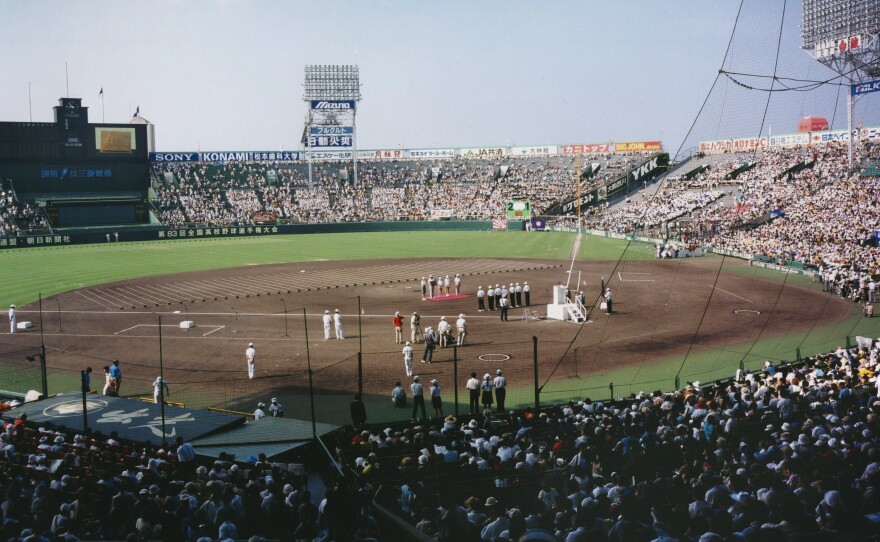 Theo and her family in Koshien Stadium during the opening ceremonies for the high-school baseball championship in Japan in 2001.