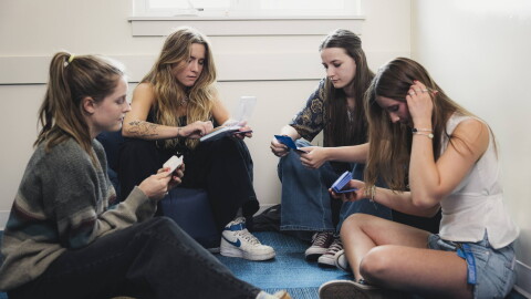 Two teens look at different kinds of birth control with an intern and staff member of Bridgercare in June 2025. Bridgercare, a nonprofit based in Bozeman, Mont., had its federal grant abruptly canceled.