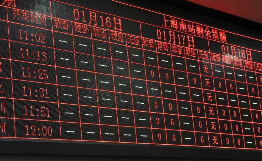 An electronic board at Shanghai Railway Station shows many trains sold out for Jan. 16-18. China's Rail Ministry spent more than $8 million on the ticketing website — which crashed and sometimes charged users without actually giving them tickets.