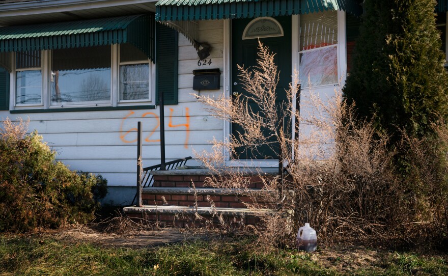 The numbers spray-painted on the front of this house in the Lost Valley neighborhood in Manville, N.J., indicate that it was bought as part of a federal disaster program. The program uses federal and local money to purchase houses that have flooded multiple times and permanently turn the lots into green space to reduce flood risk.