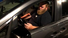 Uber Driver Jeff Perry waits in the Sacramento International Airport cell phone lot for a passenger request. Perry is currently an independent contractor, but a bill in the California state legislature may force rideshare companies to extend workers’ benefits to employees like Perry.