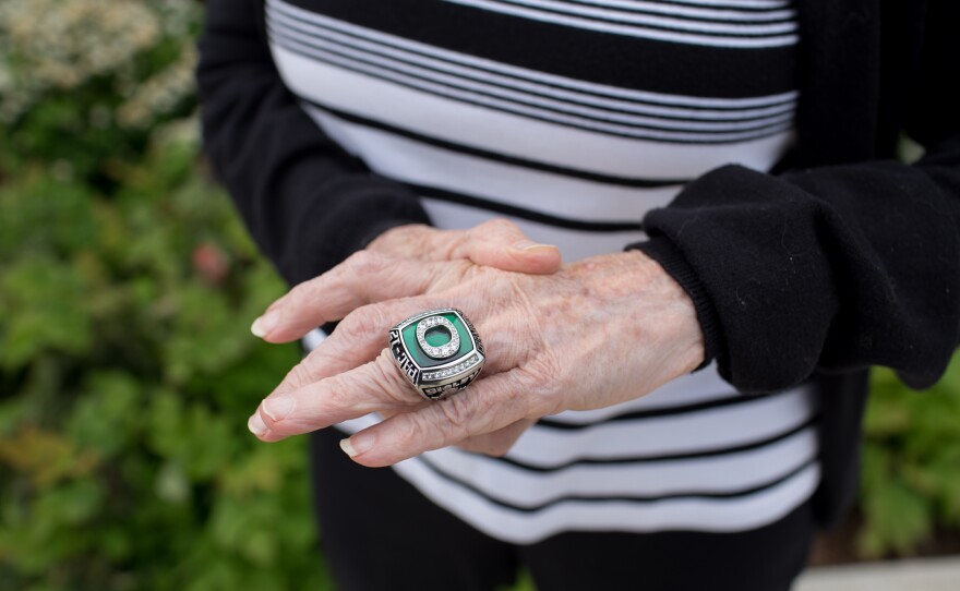 Sisley shows her PAC-12 championship ring.