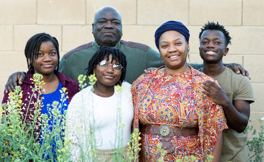 Lakisa Muhammad with her husband, Dewayne, and children Yasina, 17, Hassana, 13, and Amir, 17, in their garden at home in Maricopa, Ariz.