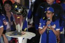 Venezuela's acting President Delcy Rodriguez, right, speaks next to the World Baseball Classic trophy a day after her team's victory over the United States in the championship match, at Miraflores presidential palace in Caracas, Venezuela, Wednesday, March 18, 2026.