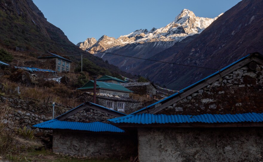 Many of the peaks near Beding have less snow and more bare rock than they used to because of global warming. They are a constant reminder of the changing climate for students and teachers at the town's monastery school.