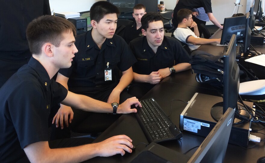 U.S. Naval Academy midshipmen taking part in the cyber exercise check to see if their computer network has been hacked by the NSA's red-cell team.