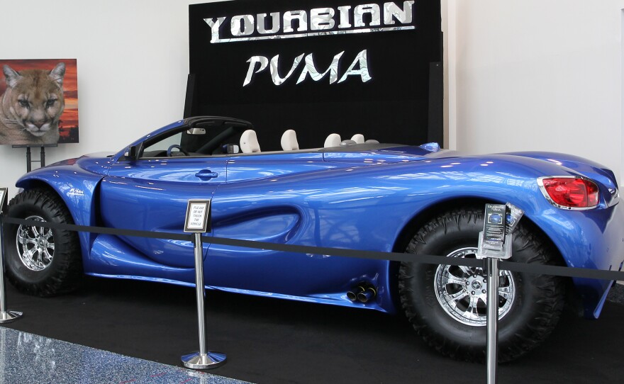 The Youabian Puma, a 20-foot convertible that sits on 44-inch tires, has been panned by auto industry critics at the LA Auto Show. Some call it "insane." Other say they hope it's just a practical joke.